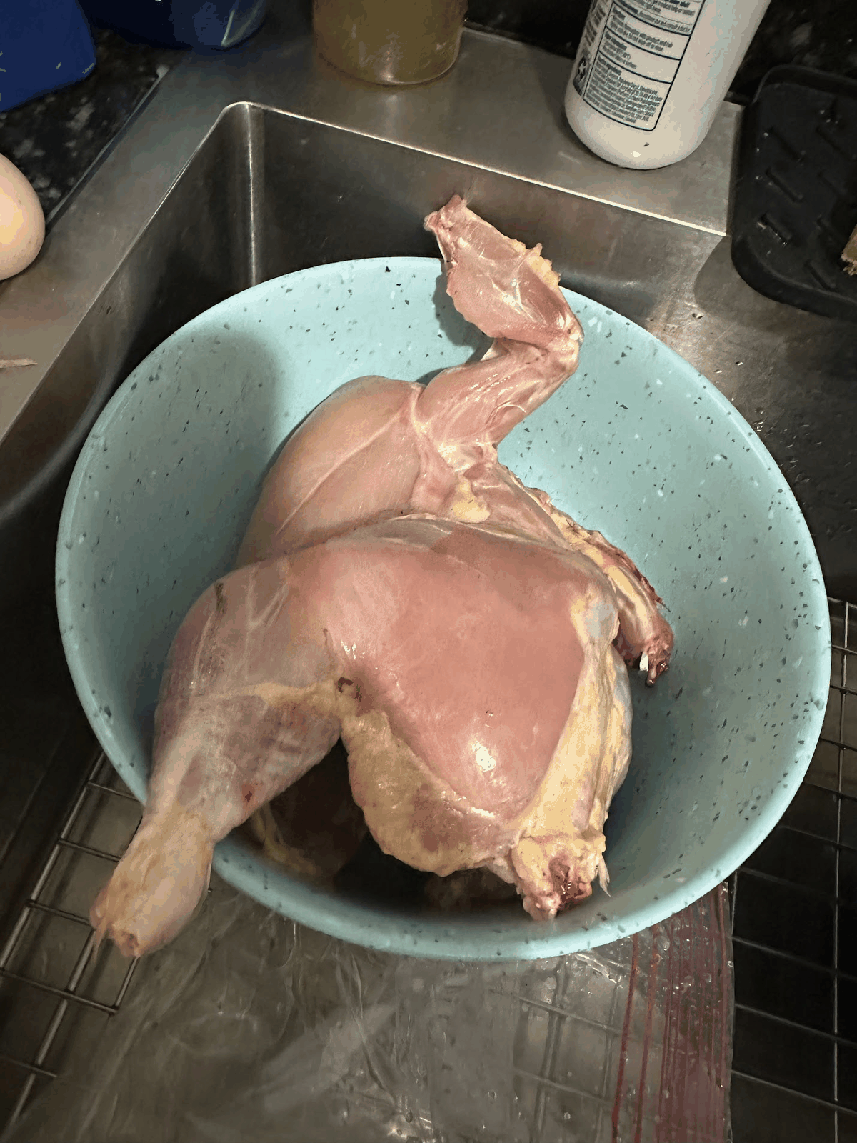 Prepared farm-raised chicken in a kitchen bowl